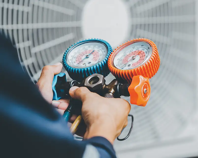 Close-up of a Precision Climate Control technician performing HVAC Performance Testing & Diagnostics in St. Charles, MO